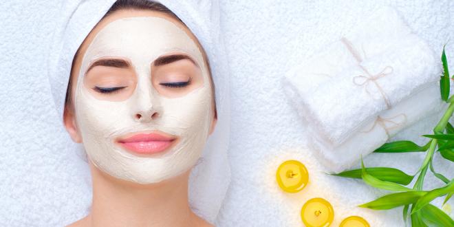 a woman enjoying a relaxing facial mask