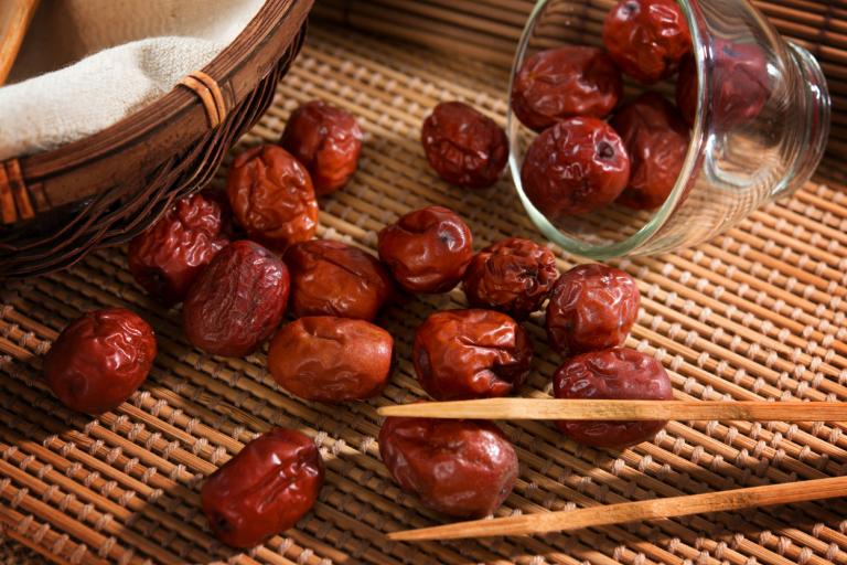 dried jujube seeds on a bamboo mat