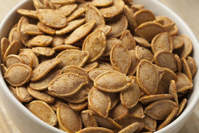 a bowl of toasted pumpkin seeds